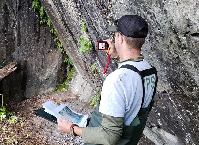CC site visit_web An NPS archeologist documents a site