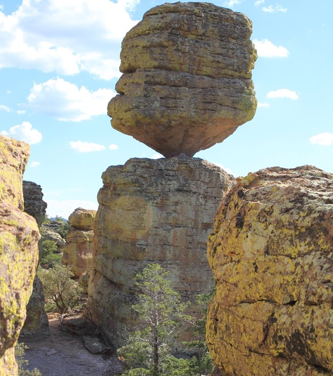Boulder balancing on a pinnacle formation