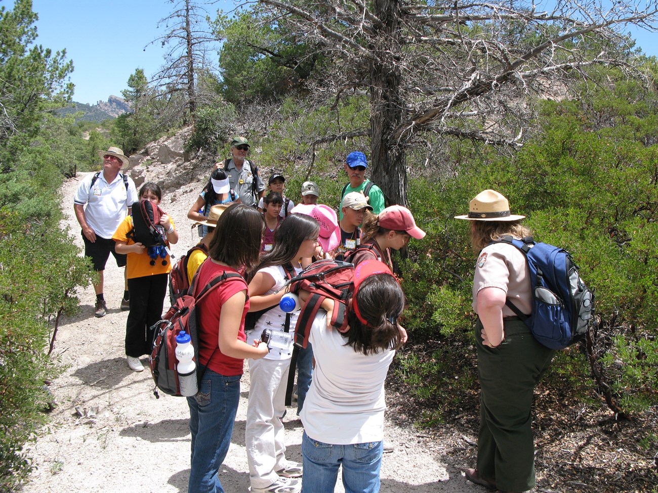CHIR Ranger Tour Ranger giving a tour on a desert trail