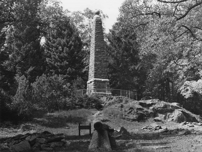Monument dedicated to the soldiers of the winter encampment in Redding, 1778-79, now part of Putnam Memorial State Park Obelisk on rocky knoll surrounded by trees