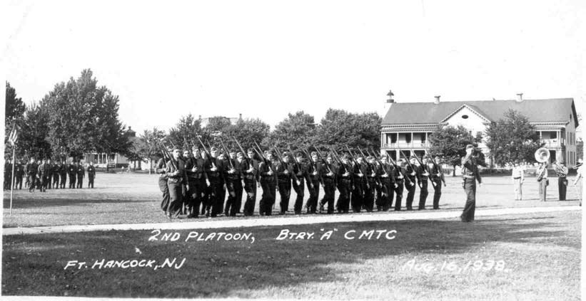 soldiers walk in a line along the parade drounds