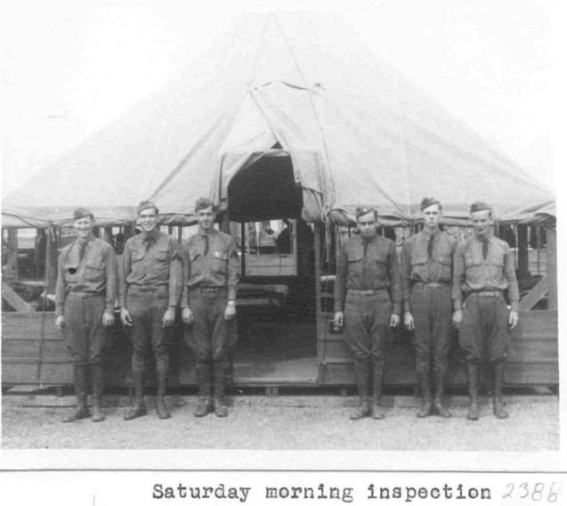 soldiers stand in line for a Saturday morning inspection