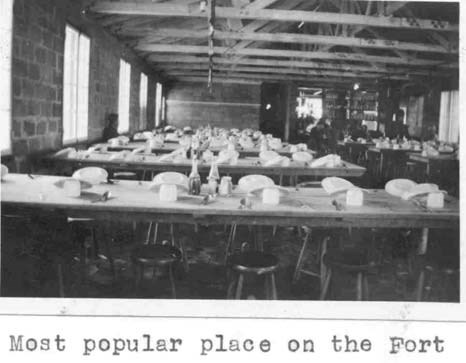 long tables with stools and place settings fill an open room