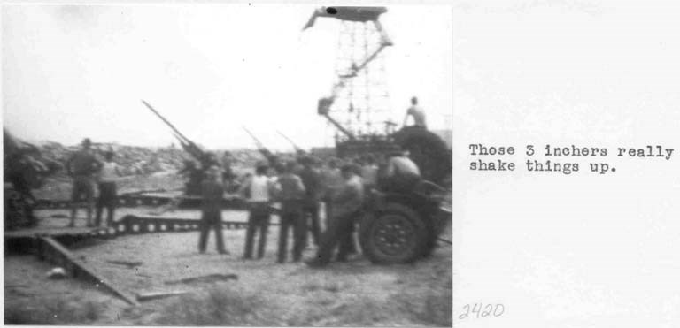 a group of men firing anti-aircraft guns