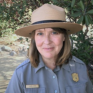 Kirn won a 2022 regional Cultural Resources Award Kirn, a blonde woman in NPS uniform and flathat, smiles at camera