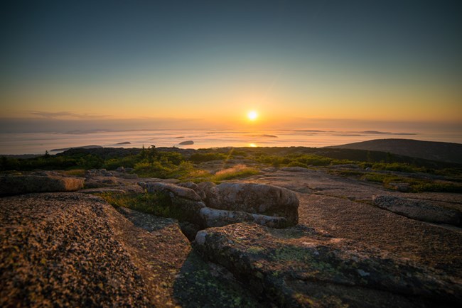 Sunrise over the rocky summit of Cadillac Mountain