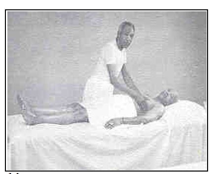 2 African American men. One man is giving a massage to the other who is lying on a table