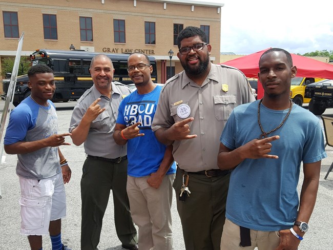 Floyd Myers with a Park Ranger and two Greening Youth Foundation interns at a George Washington Carver Day event