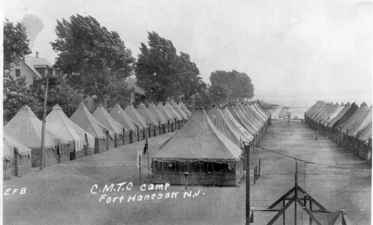 three rows of tents on grass