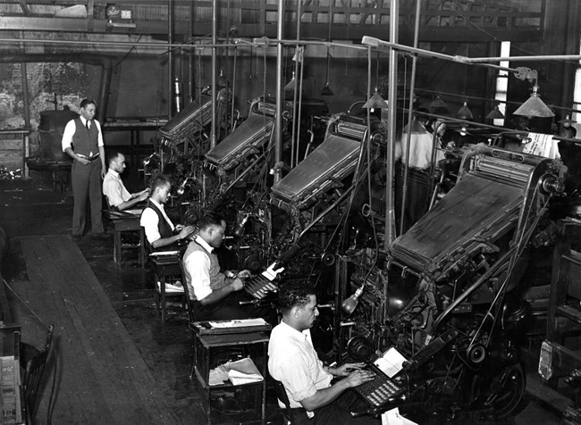 Men typing on machines
