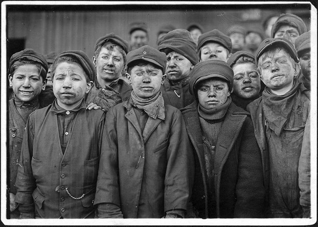 Vintage photo of a group of young boys working during the industrial revolution