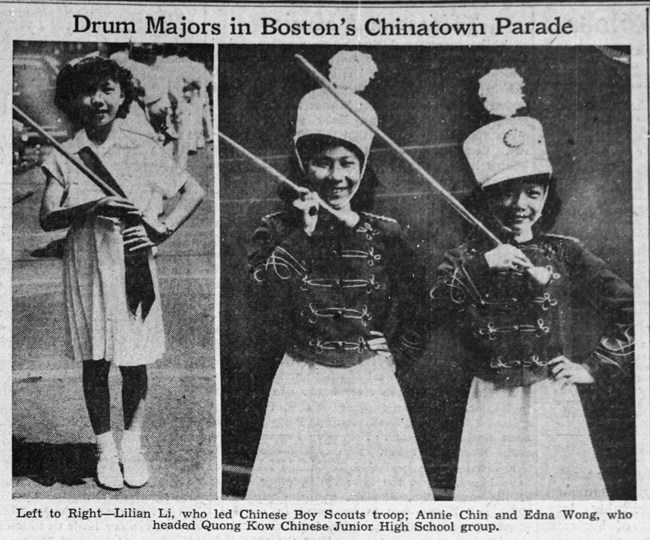 Two young Chinese girls in drum major outfits holding batons