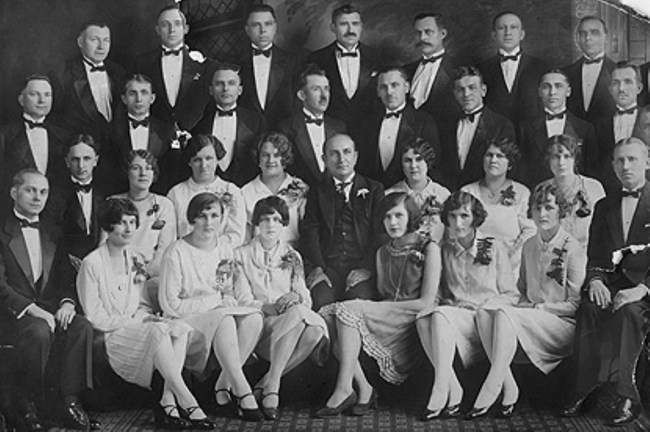 Salem's Chopin Choir A group of men and women in tuxedos and gowns for a formal portrait.