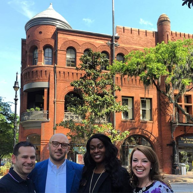 A student, Todd Heiser (Design Principal at Gensle), Mariah Goforth (SCAD Advisor), and Chrissy Terry near Poetter Hall at SCAD.