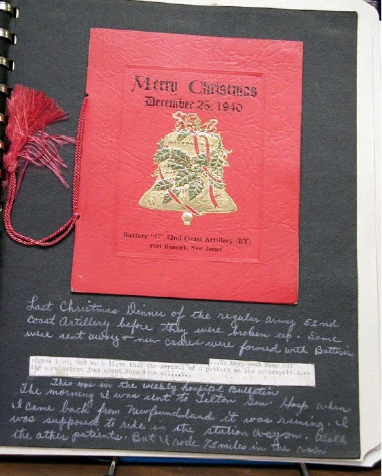 a red paper card on a scrapbook page