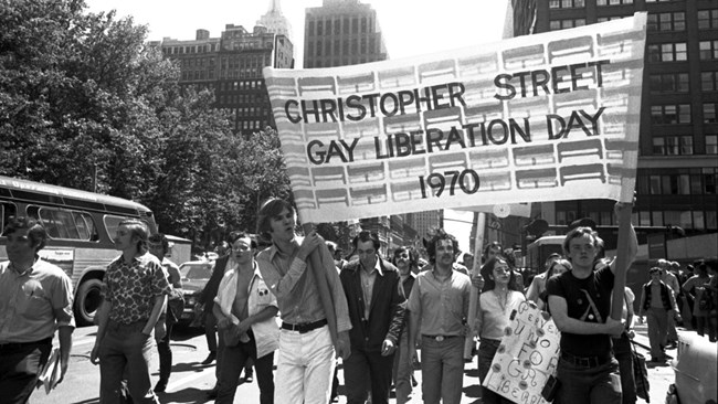 Picture from Christopher Street Gay Liberation Day with men holding a large sign