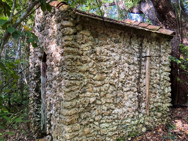 Civilian Conservation Corps limestone building surrounded by green vegetation