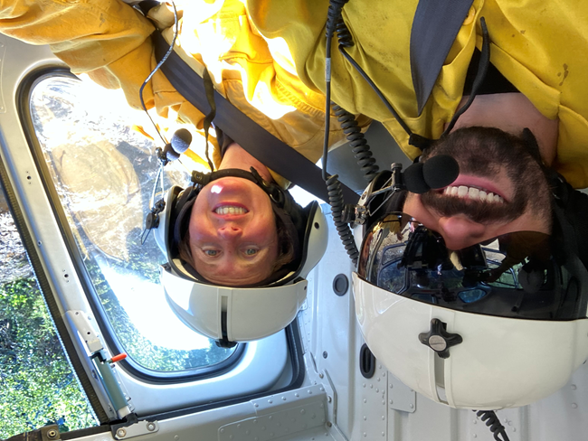 Closeup of two crew members from the BLM/Forest Service/Park Service crew on an AFS/BLM helicopter (Ryan Nessle, NPS) Closeup of two crew members from the BLM/Forest Service/Park Service crew on an AFS/BLM helicopter (Ryan Nessle, NPS)