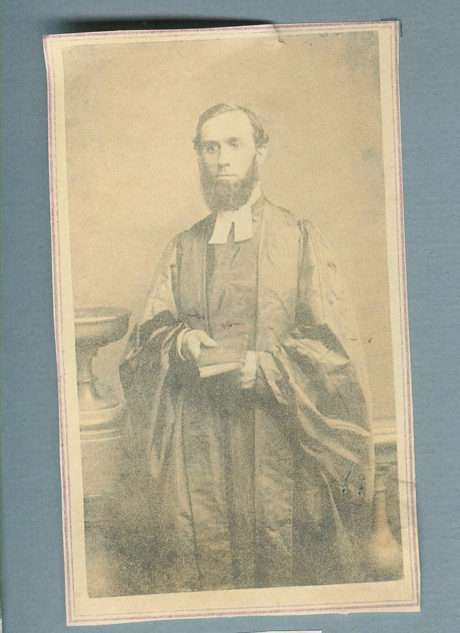 Man with beard in ministerial robes