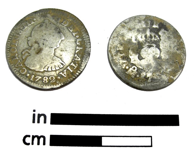 Front and back of a silver coin that has a profile and says Carolus the III, DEI GRATIA 1782. The back side is illegible.