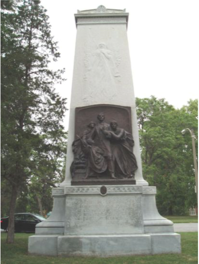 Confederate Memorial Large obelisk monument made of stone with a sculpted relief portrait at front.