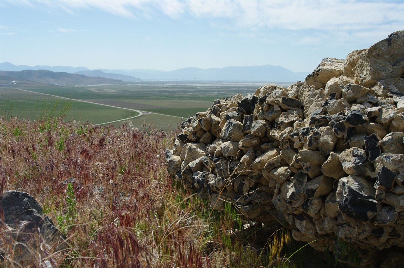 Conglomerate rock overlooking fields at Golden Spike National Historic Site. NPS photo. Conglomerate rock overlooking fields at Golden Spike National Historic Site. NPS photo.