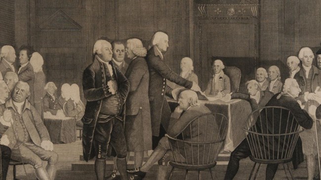 Member of the Second Continental Congress seated and standing around a table voting on independence.
