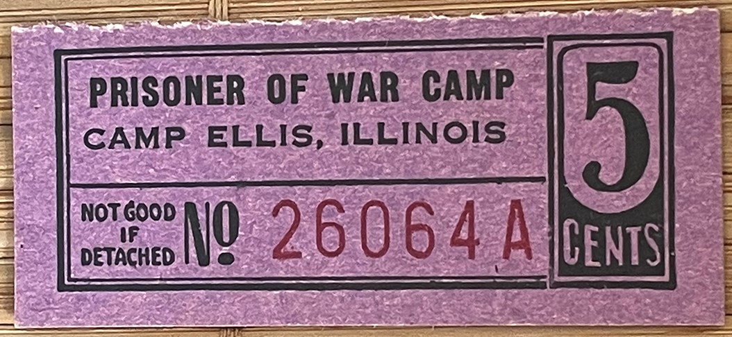 A small rectangular piece of paper. It is purple with black and red printing. Black printing reads “Prisoner of War Camp, Camp Ellis, Illinois. Not Good If Detached. 5 Cents. No.” and a serial number in red, “26064A.”