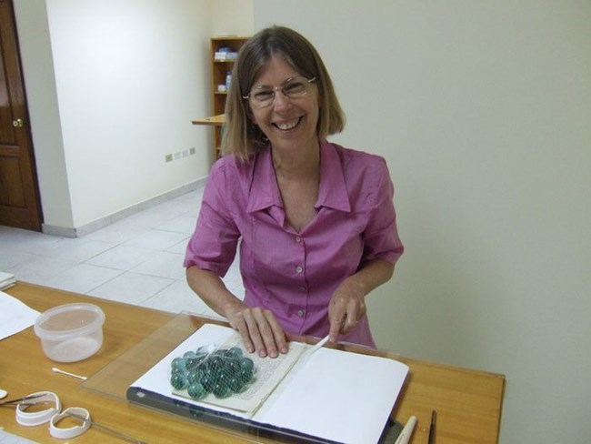 Karen Pavelka in a conservation laboratory. Karen Pavelka in a conservation laboratory.