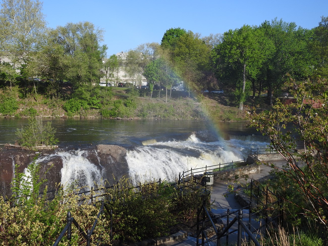 Waterfalls at the Paterson Great Falls National Historical Park are visible throughout the park alongside the facilities of the Great Falls Hydroelectric Project.