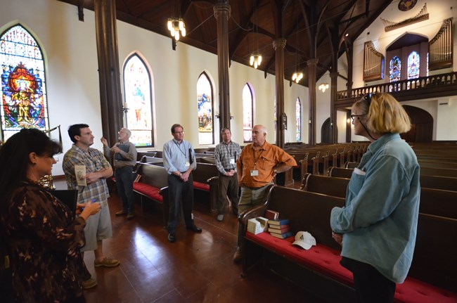 Jimmy Price talks to conference participants at Trinity Episcopal Church in Galveston after he completed masonry repair at the church. Jimmy Price talks to conference participants at Trinity Episcopal Church in Galveston after he completed masonry repair at the church.