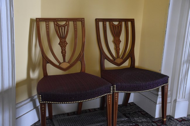 Two chairs against the wall.