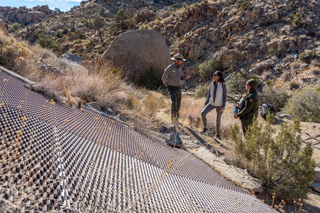 Mine closures at Desert Queen Mine Area Superintendent David Smith and Physical Science Technician Stacy Manson give Winnie Stachelberg a tour of mine closures at the Desert Queen Mine area.