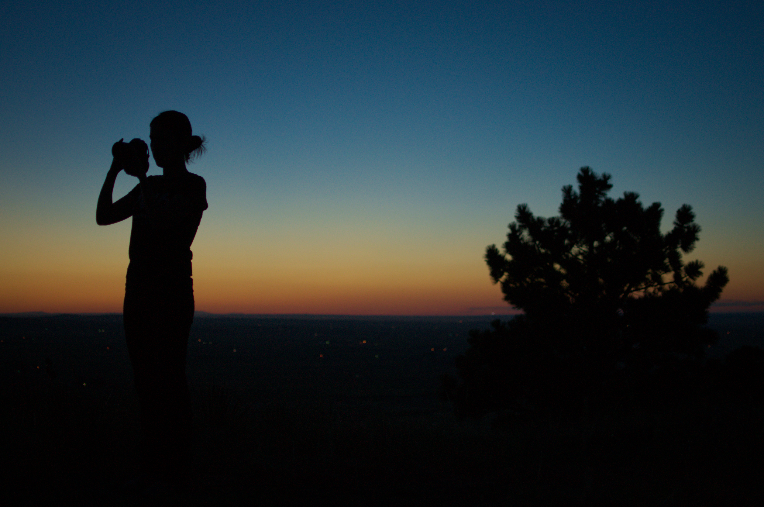 Silhouette Silhouette of Li Wei taking a photo with the night sky as a background