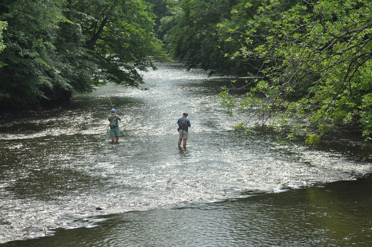 Two people fishing at Shurts Road, a public fishing access on the Musconetcong River owned by the State and managed by the NJ Division of Fish and Wildlife. Photo courtesy of Alan Hunt and the Musconetcong Watershed Association