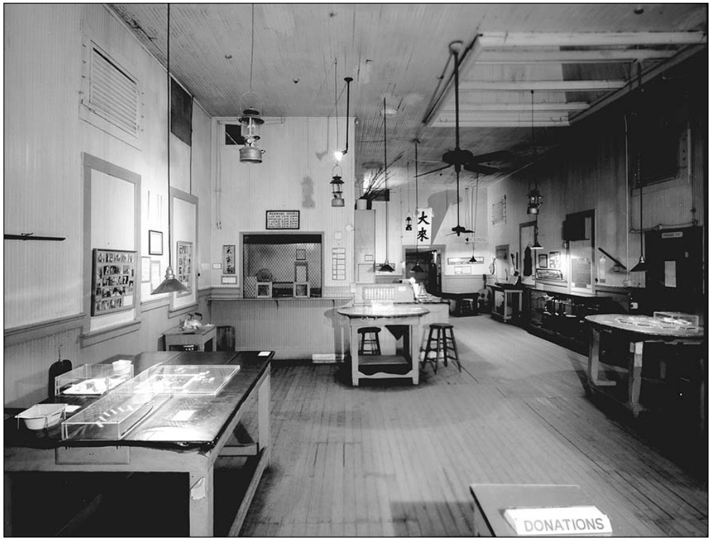 A large room with tables and artifacts on display