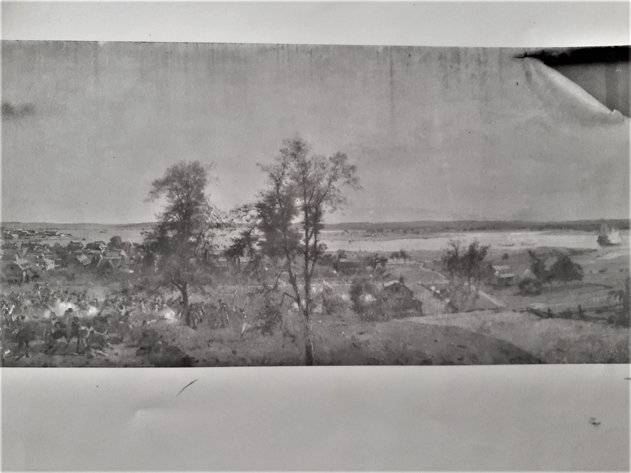 Damaged canvas painting of a landscape with soldiers fighting in the left corner.