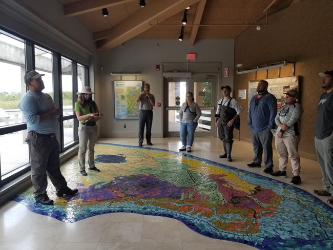 David Riera gives a safety brief to a group of visitors.