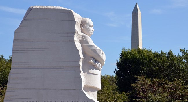 Statue of Dr. Martin Luther King Jr. with the Washington Monument in the distance