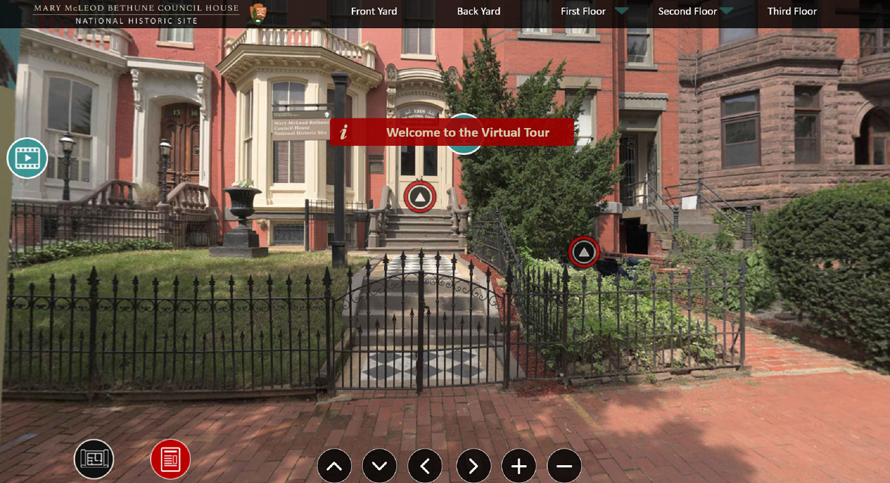 Screenshot of a virtual tour showing a line of townhouses and tour prompts