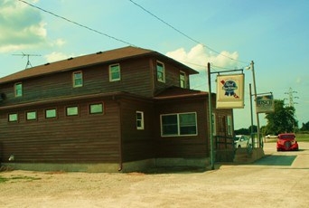 Illustration of a large brown building.