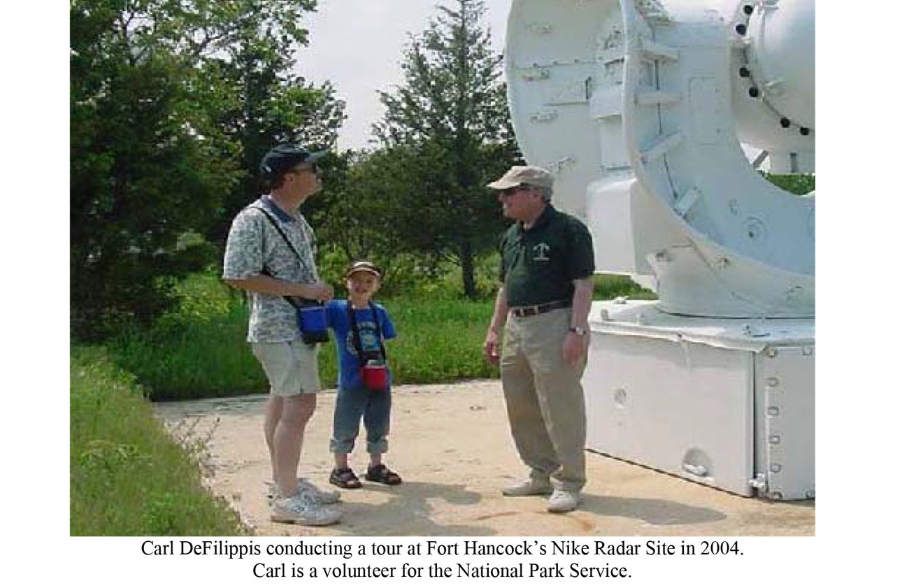 NPS Volunteer with man and young boy
