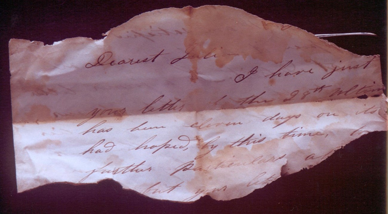 scrap of paper with the words "Dearest Julia" written on top.