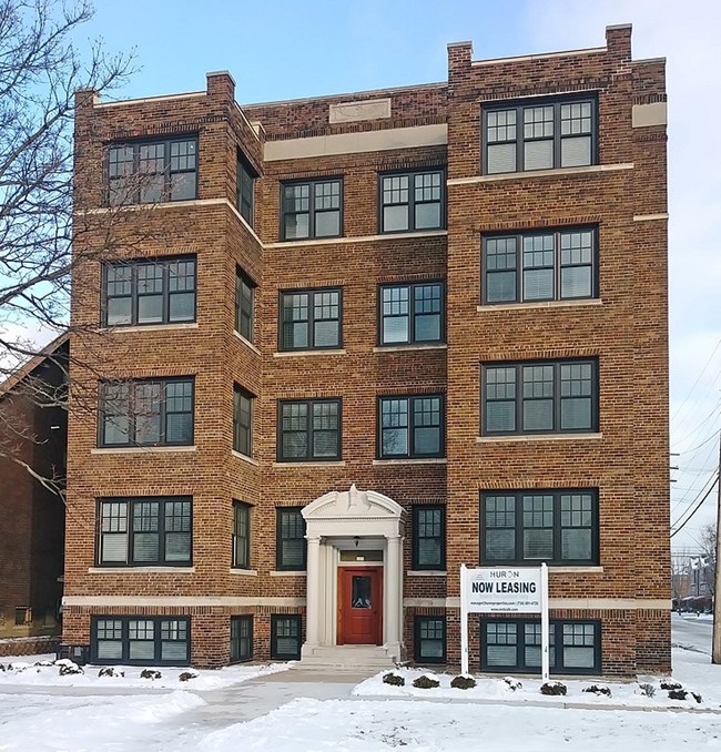 Tall brick apartment building.