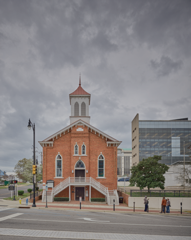 Dexter Avenue King Memorial Baptist Church Color HABS photograph showing main front elevation of a symmetrical orange brick church with gothic arch windows and belfry.