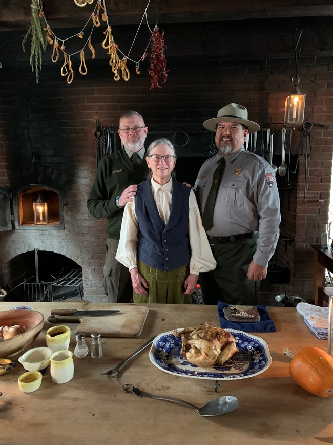 Director Sams visits with Park Ranger Scott Irvine and Volunteer-in-Parks Nancy Funk at the Fort Vancouver Kitchen in March of 2022.