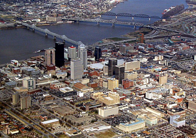 Downtown_Louisville,_Kentucky Color photograph of downtown Louisville, Kentucky, buildings and roads.