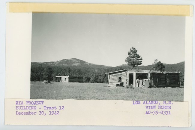 photo of two wooden structures on a note card