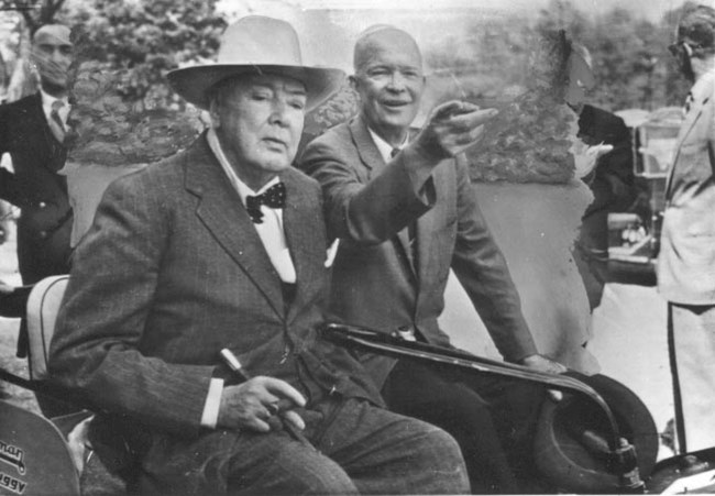 Eisenhower and Churchill A black and white image of Dwight Eisenhower and Winston Churchill in a golf cart