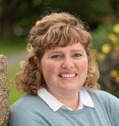 Headshot of a white woman smiling